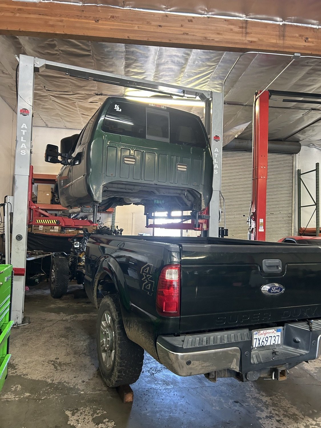 Truck cab tilted for service in the shop